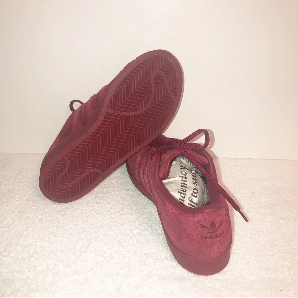 Adidas superstar suede burgundy shell toe sneaker.